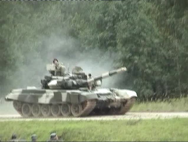 KUBINKA - SEPTEMBER 9: The T-90, a Russian third-generation main battle tank, is on the run in tank show on September 9, 2006 in Kubinka, Russia.