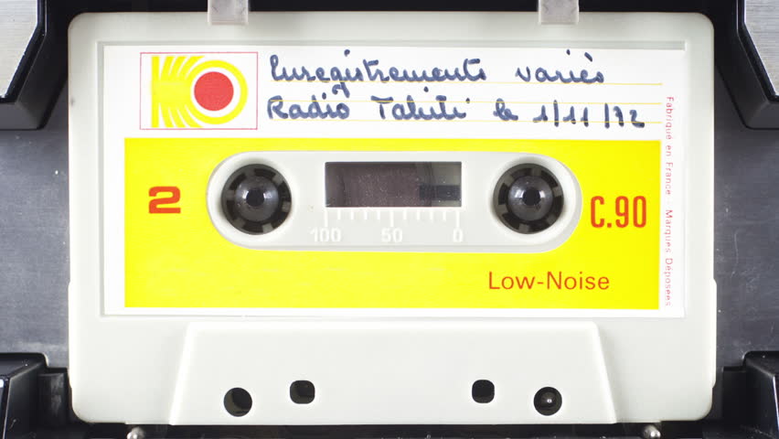 sequence of old audio cassettes in a retro tape player
