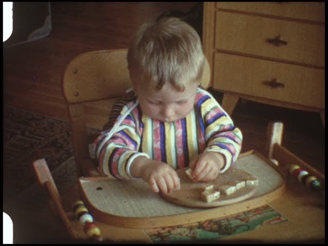 Baby eating bread (vintage 8 mm amateur film)