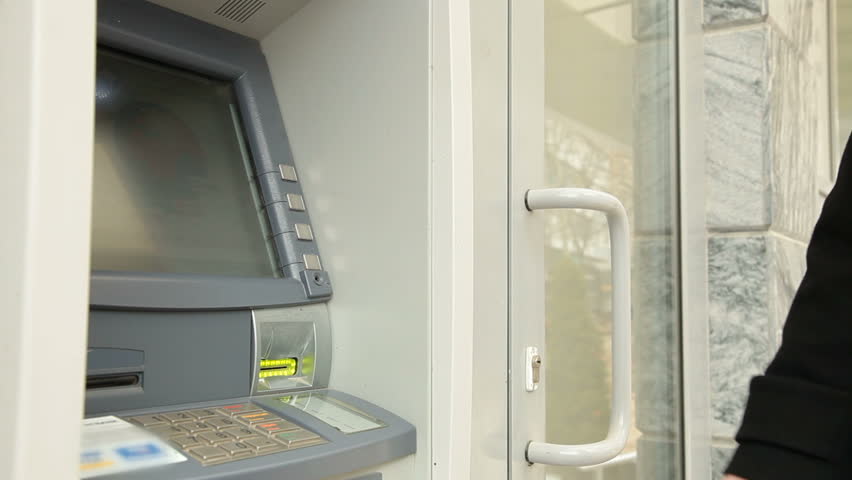 Woman Using Credit Card, Taking Money From ATM Machine