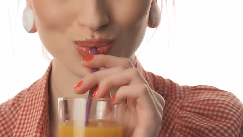 beauty woman portrait of pin-up lips drinking juice