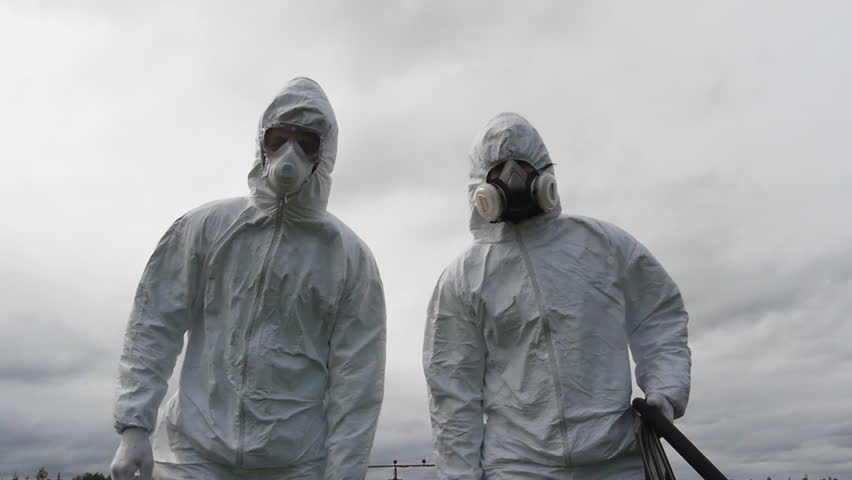 two man in uniform carrying lethal chemical product