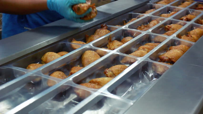 Vacuum packaging of products at poultry farm