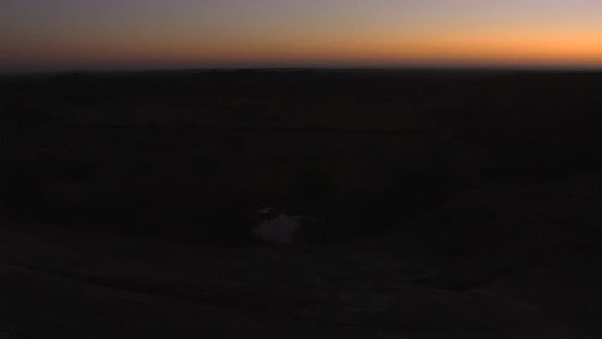 Silhouetted horizon as dawn breaks 