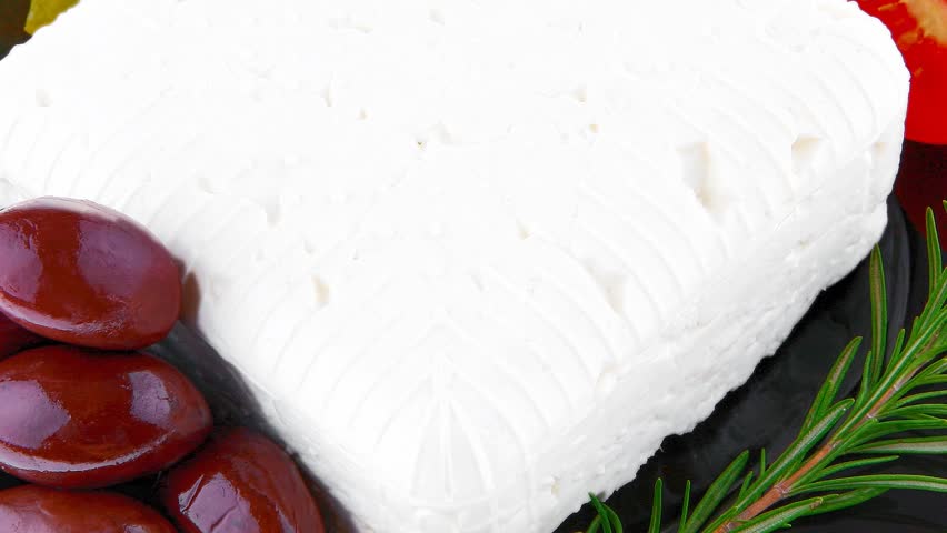 feta cube on black plate