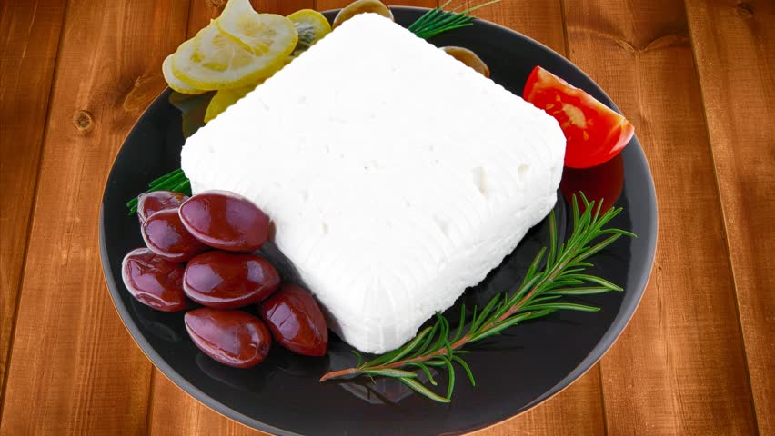 feta cube on black plate