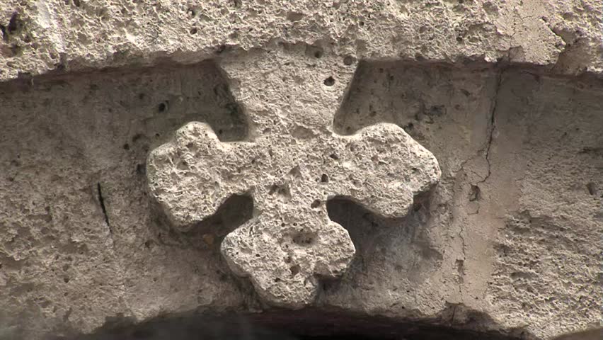 Orthodox Monastery Springhead original "Izvor", Serbia 2011.  August 8th. Faithful on the orthodox holiday dedicated St Paraskeva.Stone cross close up