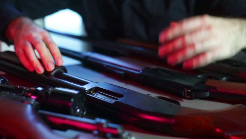 Guns at a gun show. 
Studio area, fake setup