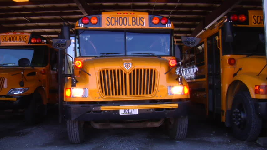 MISSOULA, MONTANA - CIRCA 2010: Three school buses parked in garage