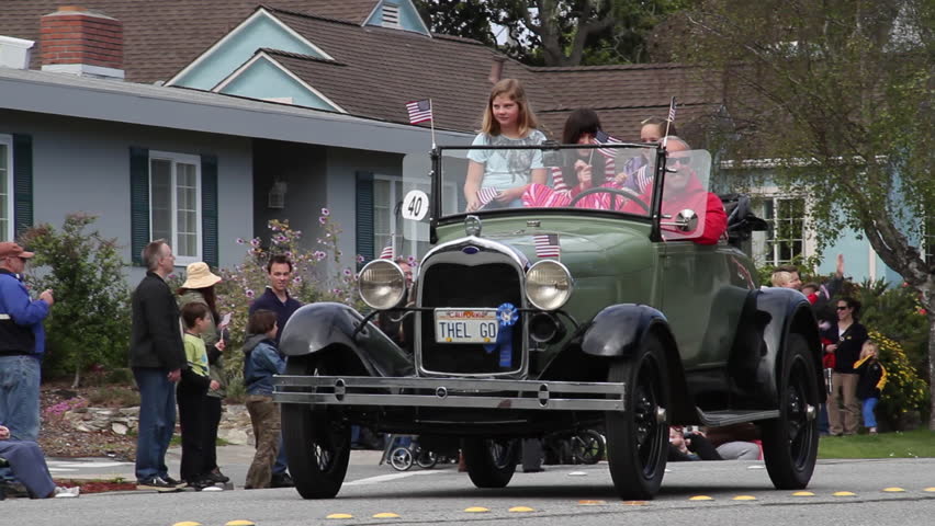 PACIFIC GROVE, CA - CIRCA 2012: family in old model A Ford in parade