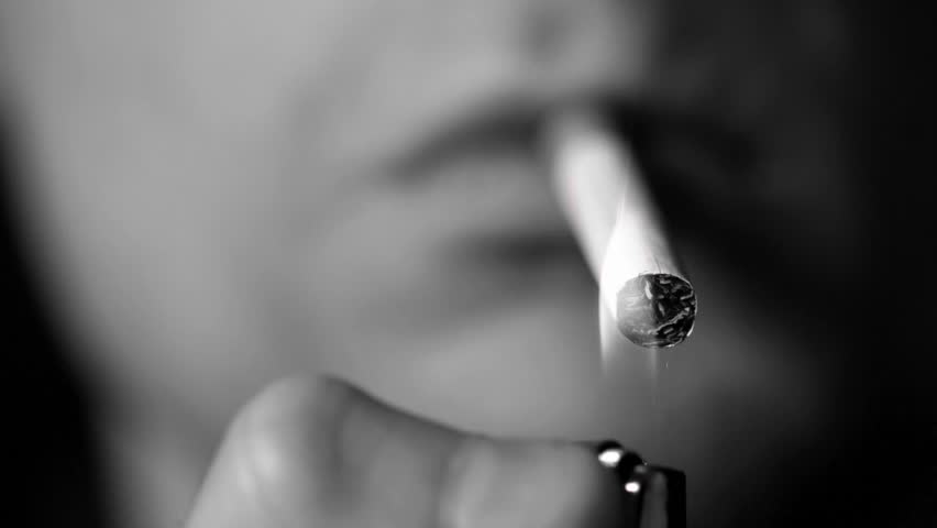 Man lighting cigarette in slow motion