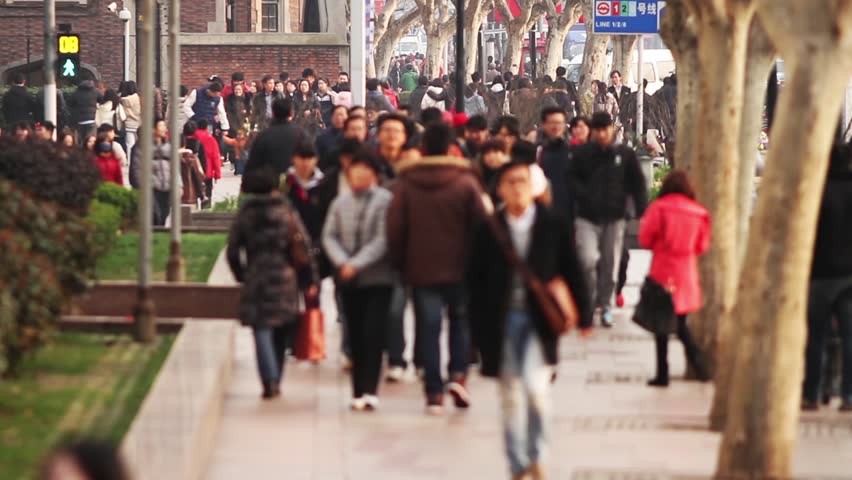 Busy Street Traffic in Shanghai, China. Anonymous Crowd. 