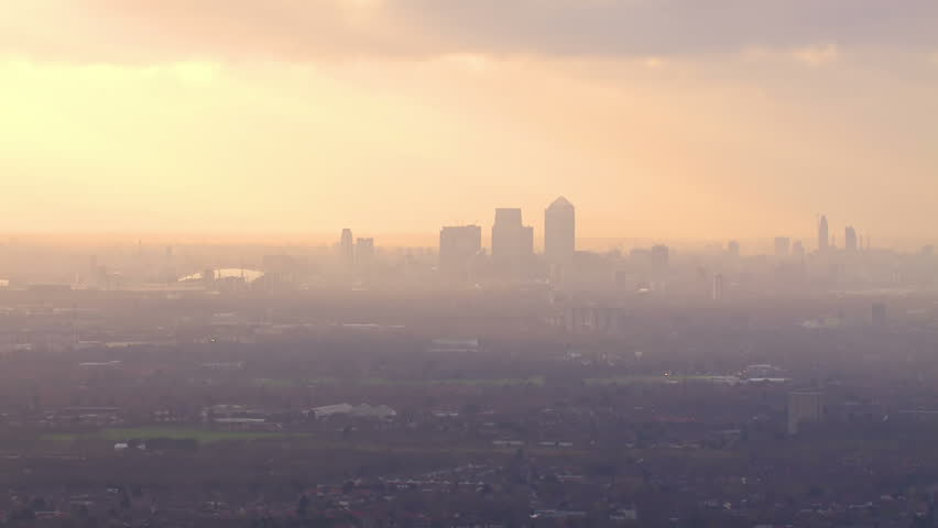Panoramic aerial shot and cloudscape featuring the London skyline on a hazy autumn morning