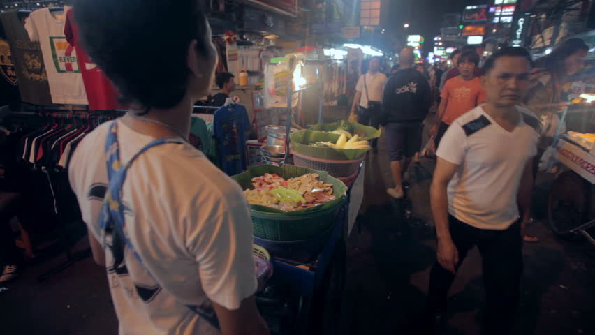 BANGKOK - NOV 20: Food vendors on Khao San Road at night on 20 November 2012 in Bangkok, Thailand. Khao San road is the mekka for all tourists arriving in the capital.