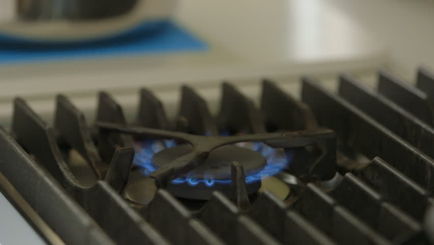 Silver pan on hob and ignition     