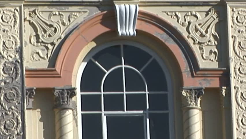 Close up of Romanesque building window facade detail