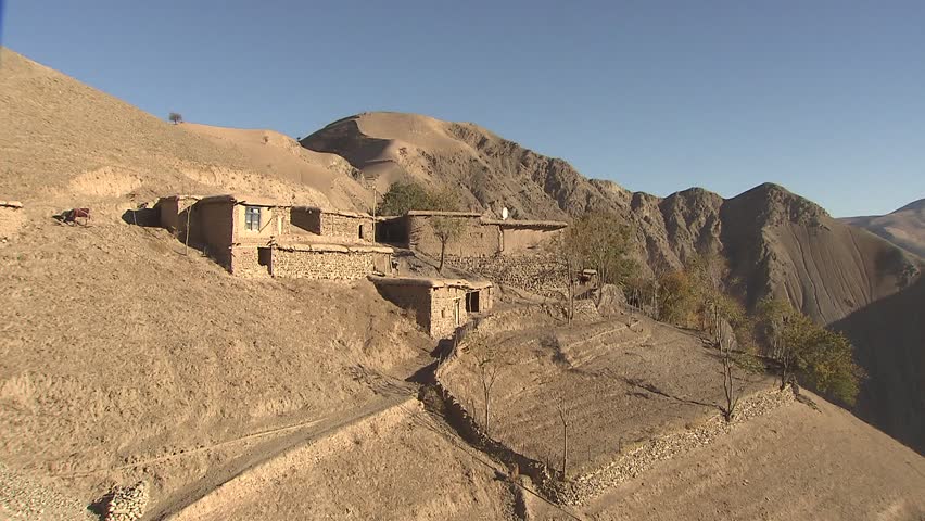 Pan over mountain village in the Hindukush mountains in the far north-east of Afghanistan.