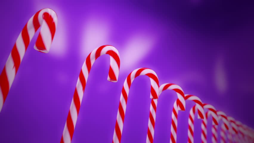 Hard cane-shaped candy sticks with traditional white and red stripes, flavored with peppermint is very popular during Christmas holidays. Animation is loopable.