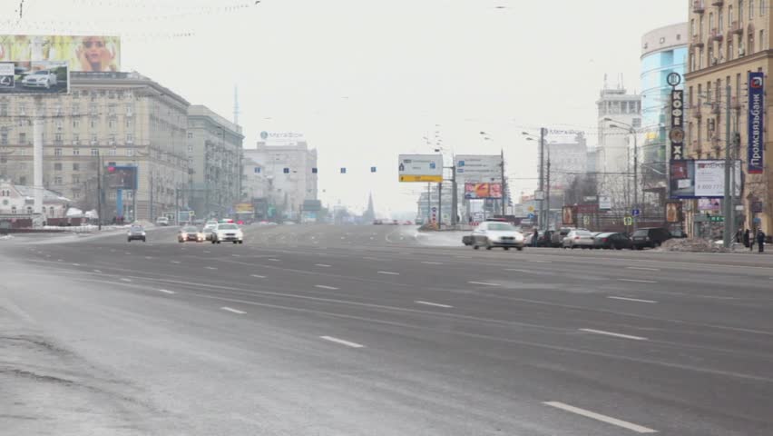 MOSCOW - DEC 20: Governmental motorcade with flashers ride by Kutuzovskiy avenue very fast, panoramic motion, Dec 20, 2011, Moscow, Russia