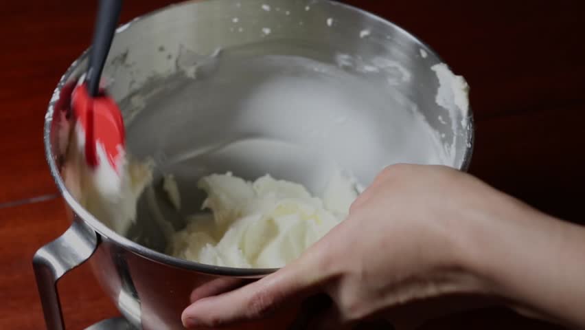 Butter cream for frosting in a steel bowl