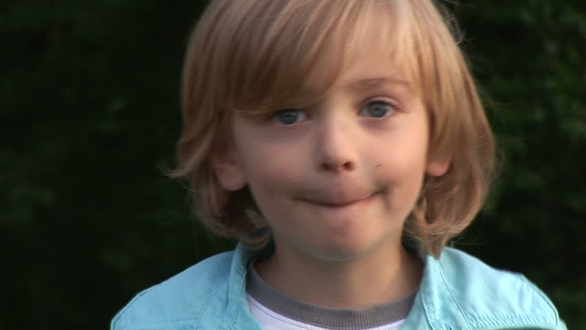 HD1080i Young blonde caucasian boy making a face.
