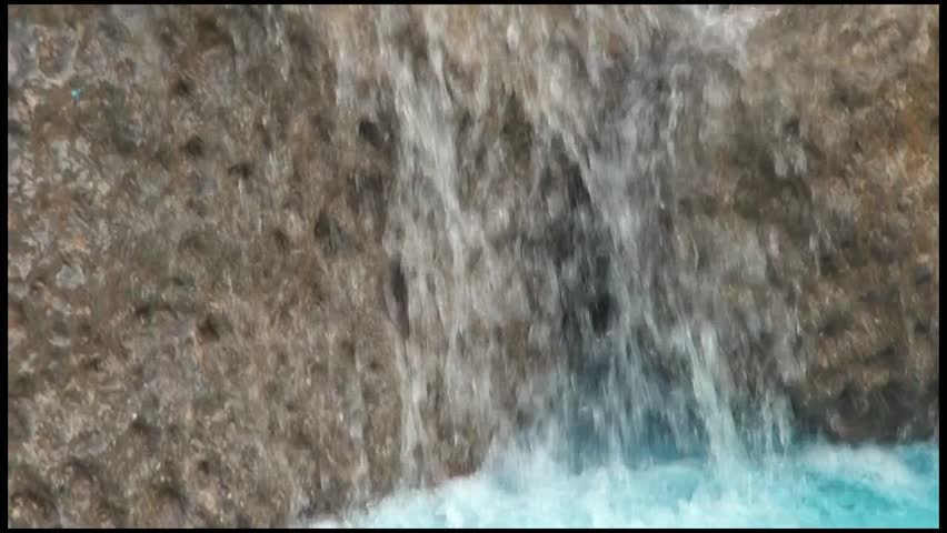 Water Fall: Water cascades down a fountain in Kishkindha Moolika Bonsai Garden in Mysore city, India. Set among serene environs of Sri Ganapathy Sachchidananda Swamiji's Ashrama.