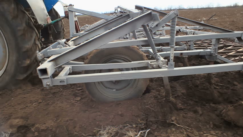 Tractor working on the filed.