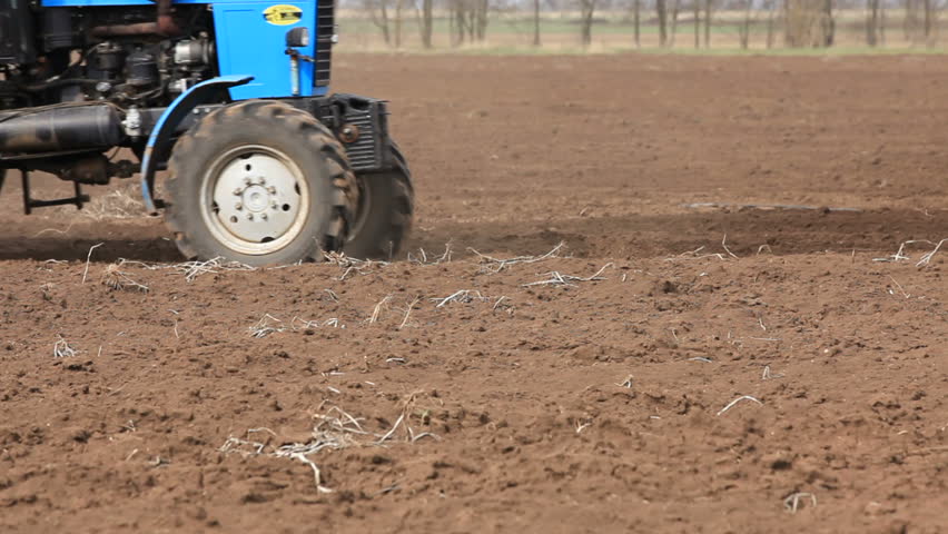 Tractor working on the filed.
