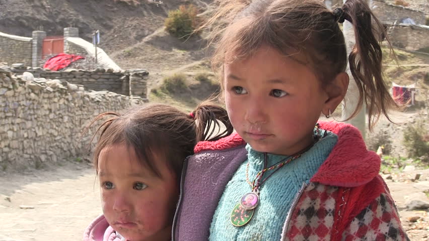 ANNAPURNA REGION, NEPAL â CIRCA OCTOBER 2011 â Detail of two little tibetan refugee girls circa October 2011 in Annapurna region in Nepal.