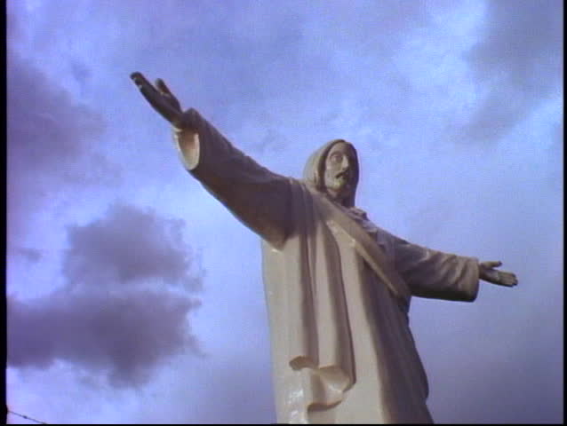 Cusco, Peru, The Andes, Jesus statue above close-Cusco, medium close up