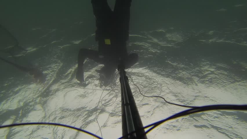 NORTHERN ISRAEL â MARCH 31: Spear fisherman spearfishing underwater, while searching for big and fat fish and octopus, March 31, 2013