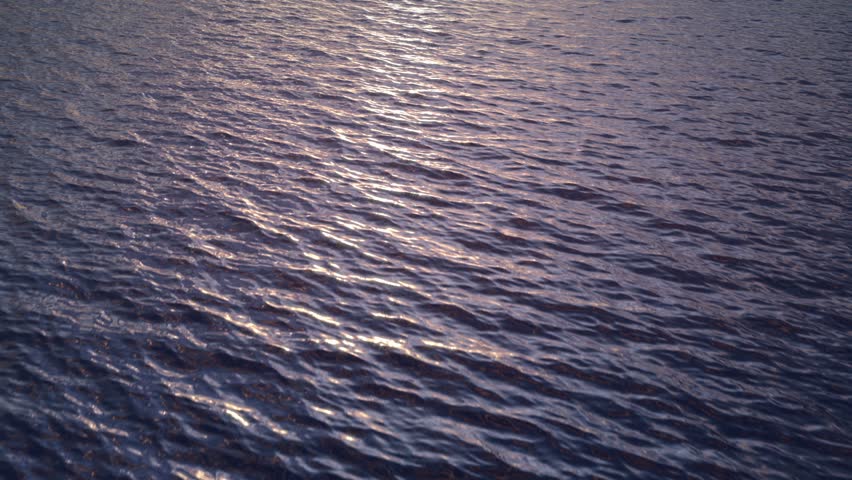 fast fly over evening ocean water surface with smooth waves, loopable. (HD, high definition 1080p, seamless loop). Great background for movie credits