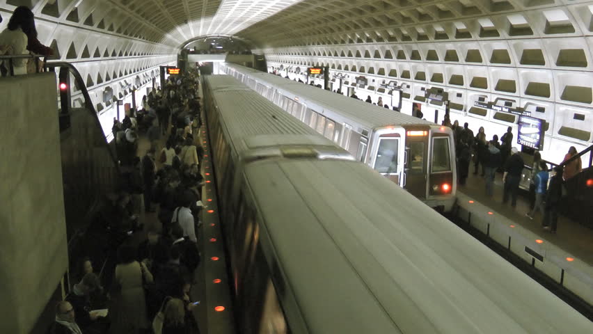 WASHINGTON, DC, APRIL 22, 2013 -- Commuters left on platform as overcrowded Metro train leaves Farragut West station, result of another train breakdown in Washington's aging Metro subway system.