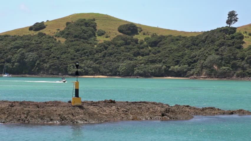 New Zealand. March 2013. A cardinal mark indicates one of the four compass directions, This cardinal mark Indicates that the deepest and safe water to pass on is the west side of the mark 



