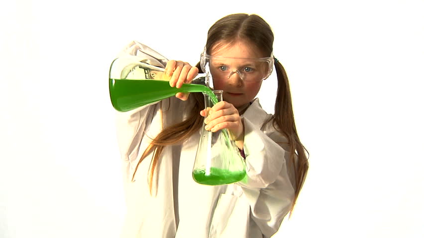 Young Scientist - A little girl, wearing adult safety glasses and lab coat, decants green liquid from a conical flask.