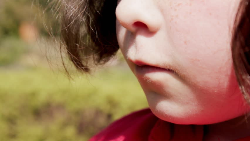 Child using asthma inhaler CU