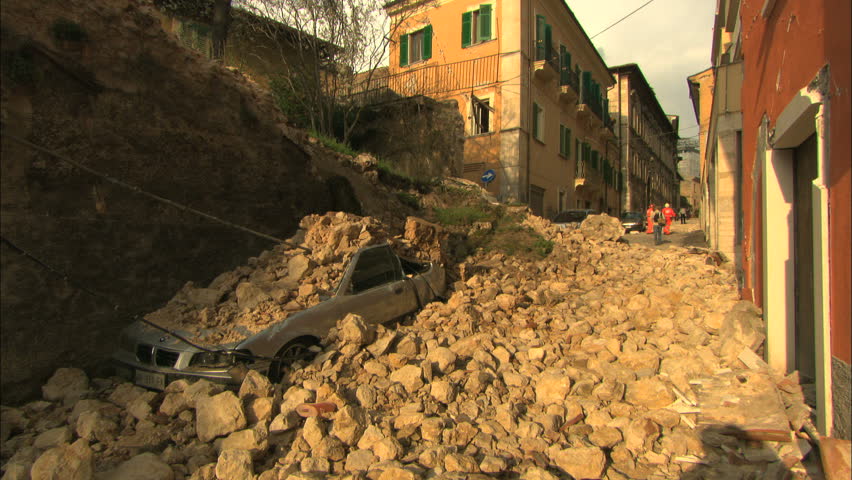 L'AQUILA, ITALY - CIRCA 2009: Car after the 2009 L'Aquila earthquake.