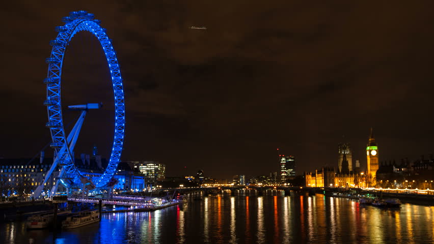 LONDON - APRIL 14: London skyline night view with London Eye on April 14, 2013 in London, UK. London Eye is the tallest Ferris wheel in Europe at 135 meters. 
