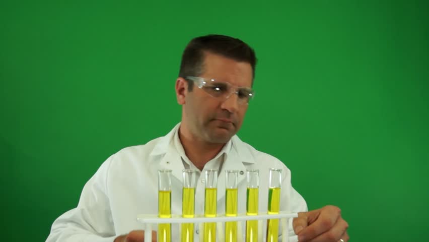 Laboratory Worker Testing Urine Samples on a Green Screen