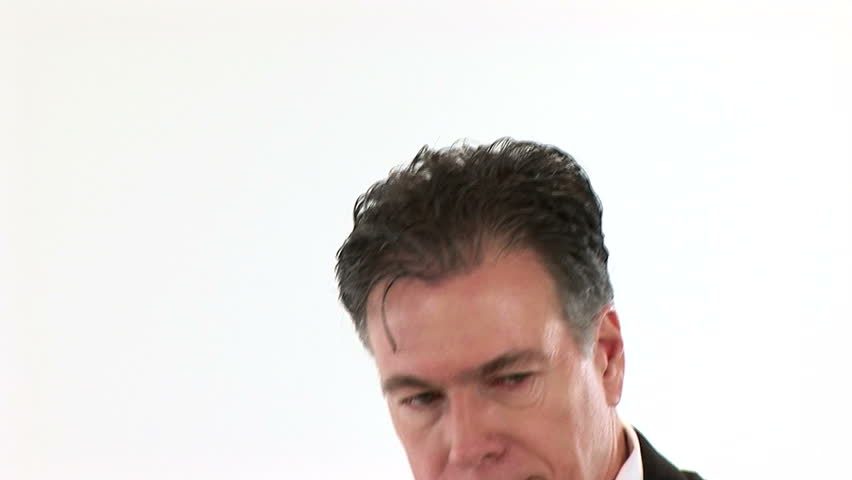 An unemployed white collar worker searching through the want ads.