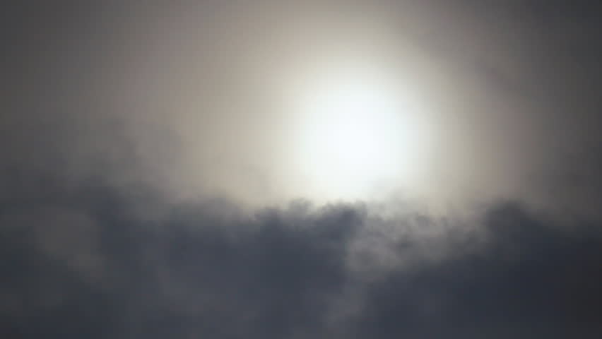 Sun behind density grey smog