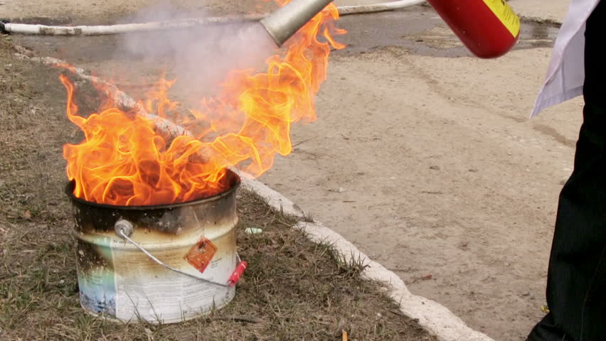 Man using fire extinguisher