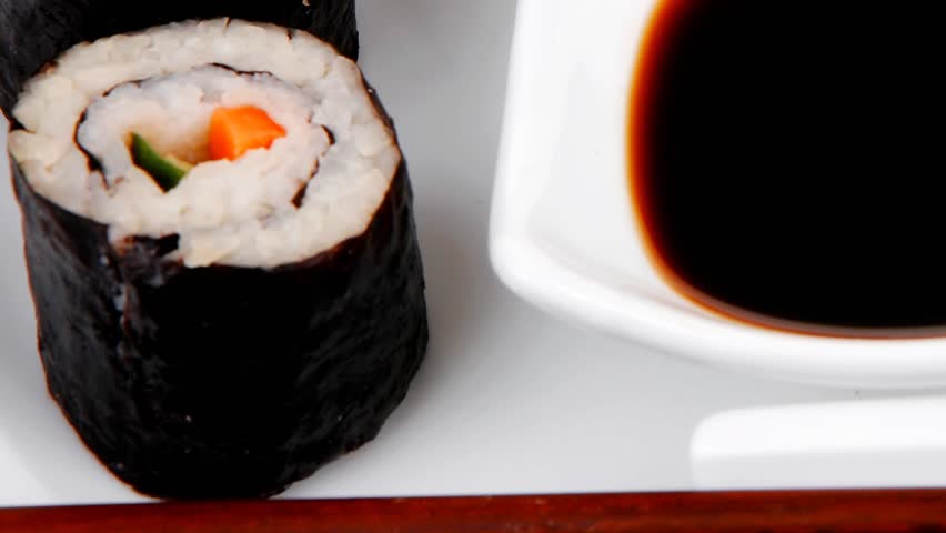 Japanese traditional Cuisine - Roll with Cucumber Cream Cheese with raw Tuna(maguro) and Salmon(sake) inside. dish with sticks 1920x1080 intro motion slow hidef hd