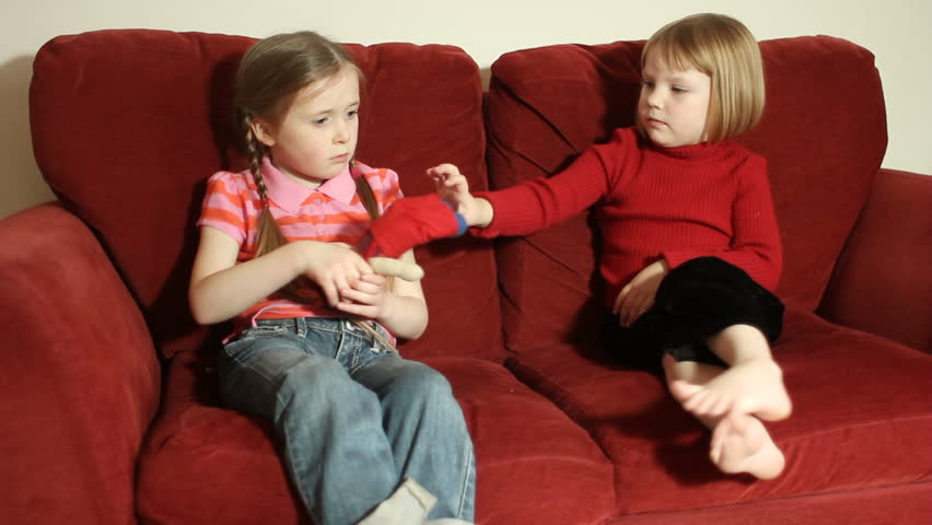A Brother And A Sister Fighting Over Who Will Control The Remote ...