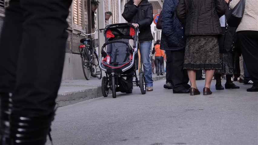 PORTO SAN GIORGIO, ITALY - SEPT 22, 2012 - People walking on street
