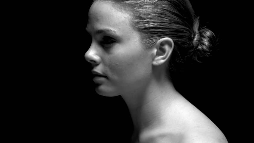 Woman's profile in black and white. Experimental lighting. 