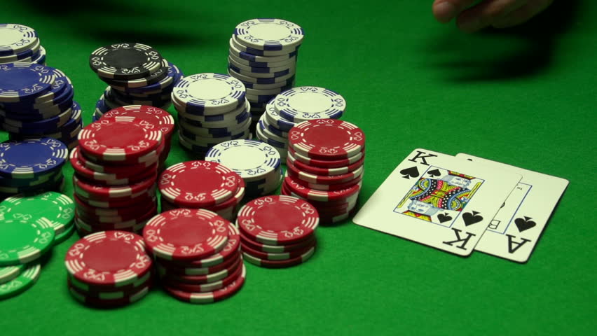 Poker players wins and takes the money
