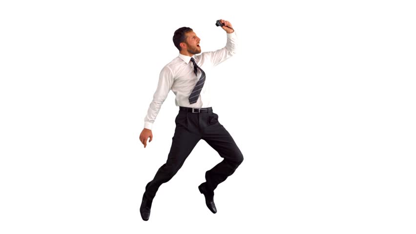 Businessman jumping and taking self portrait in slow motion