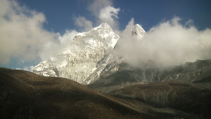 Clouds and mountains near the base of Mt. Everest at sunset. 