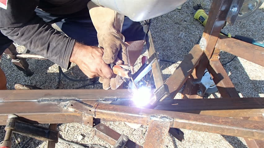 Man using an arc welder